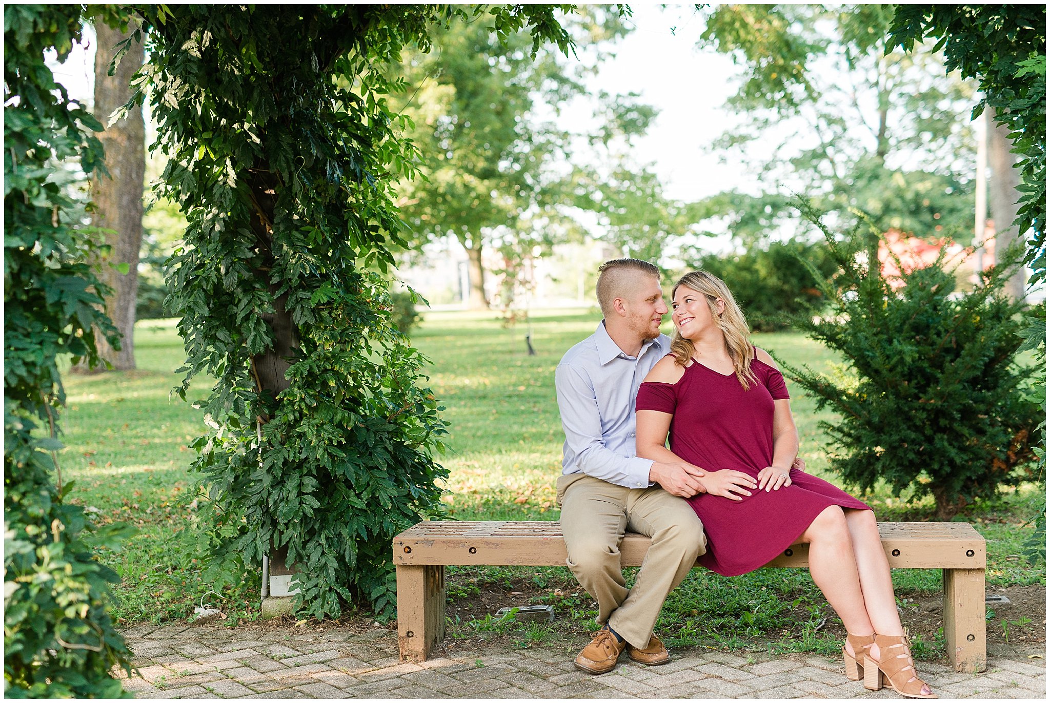 Engaged couple sitting on a bench in Winchester Kentucky